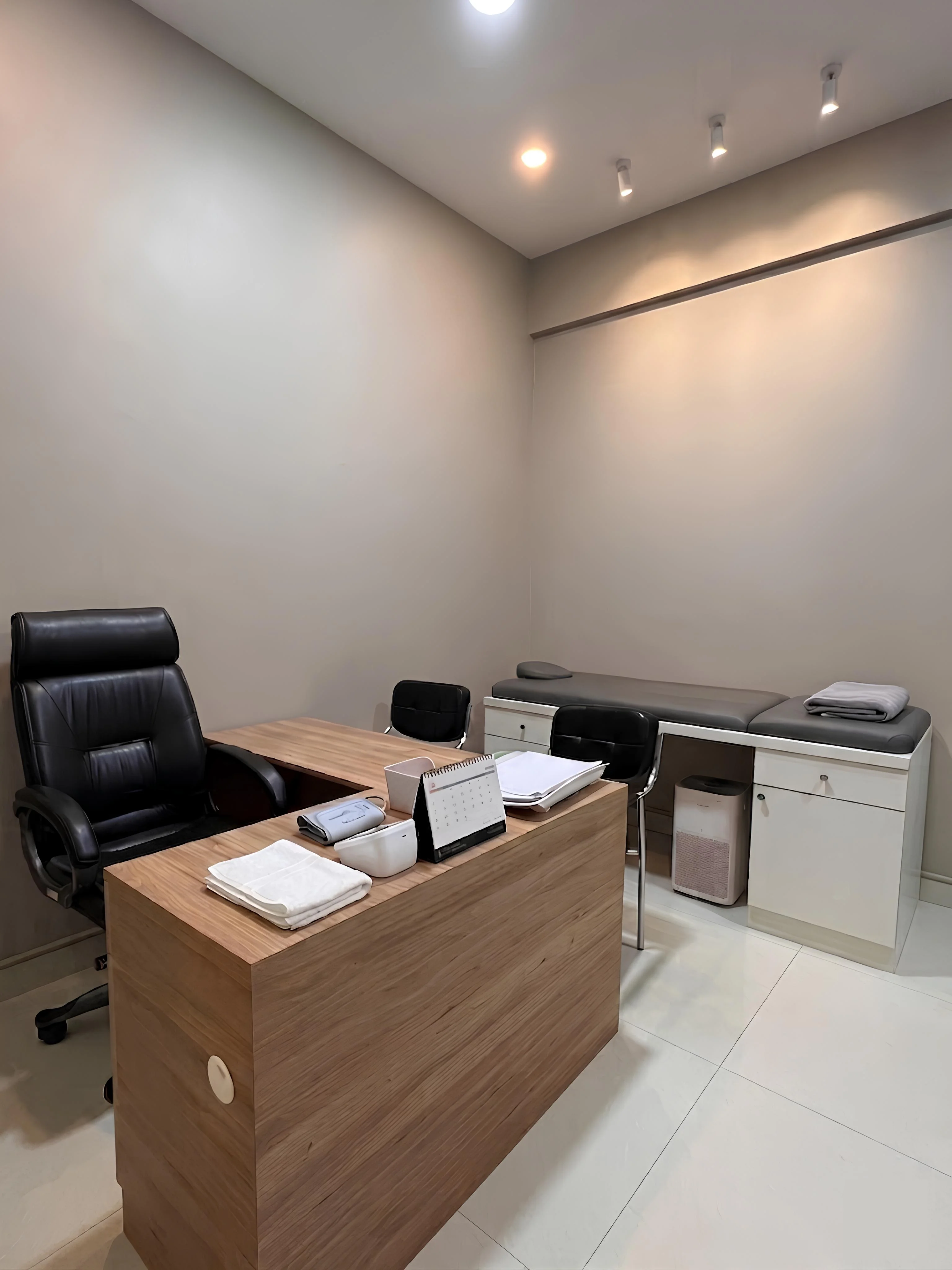 Private general treatment room for adult manual therapy and consultations