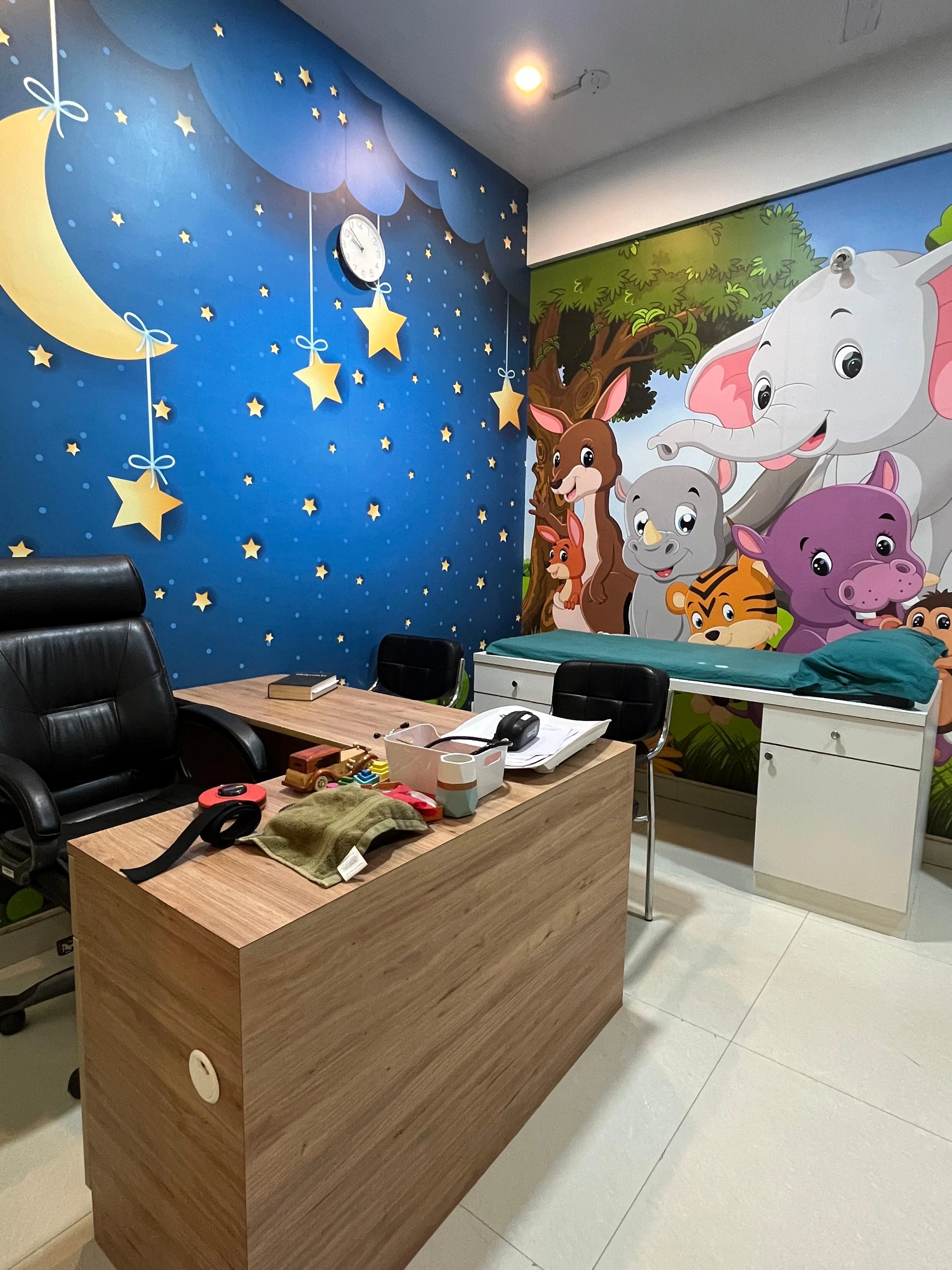 Child-friendly paediatric treatment room with colorful illustrations